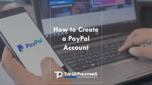 A Filipino holding a smartphone and laptop is asking "How to Create Paypal Account in the Philippines?"