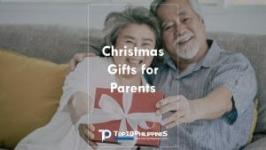 Filipino elder parents receiving Christmas gifts